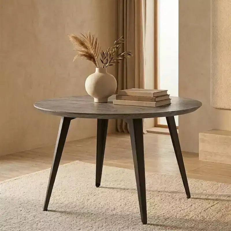 Table à manger ronde LeisureMod Ravenna de 47 pouces en bois, table de cuisine 4 personnes, pieds fuselés modernes en métal noir, parfaite pour les coins bistrot et les restaurants