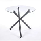 Table à manger ronde avec pied en métal noir et plateau en verre trempé, design moderne peu encombrant pour cuisine ou salon